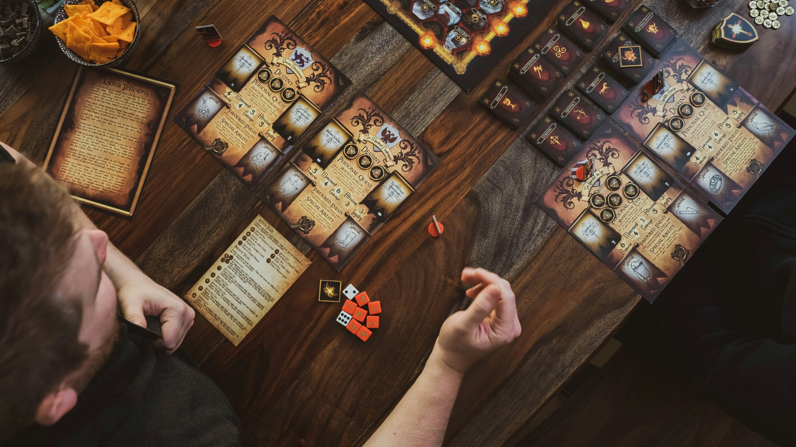 best horror board games collection showing Arkham Horror Betrayal at House on the Hill and Mansions of Madness on table