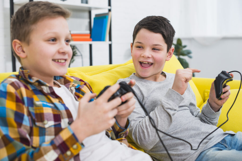 best Nintendo Switch games for kids showing Mario Bros Wonder and Kirby Star Allies on Nintendo Switch screen with child playing in handheld mode on couch