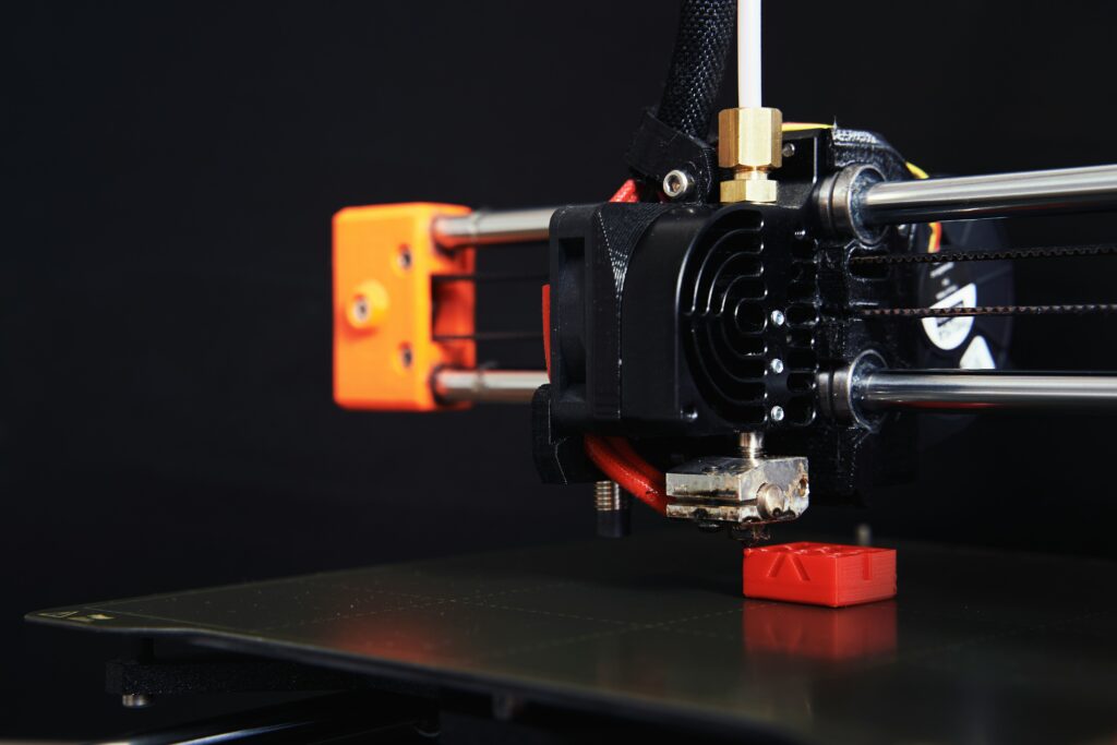 large format 3d printer showing a big enclosed corexy 3d printer producing an oversized object representing industrial scale additive manufacturing