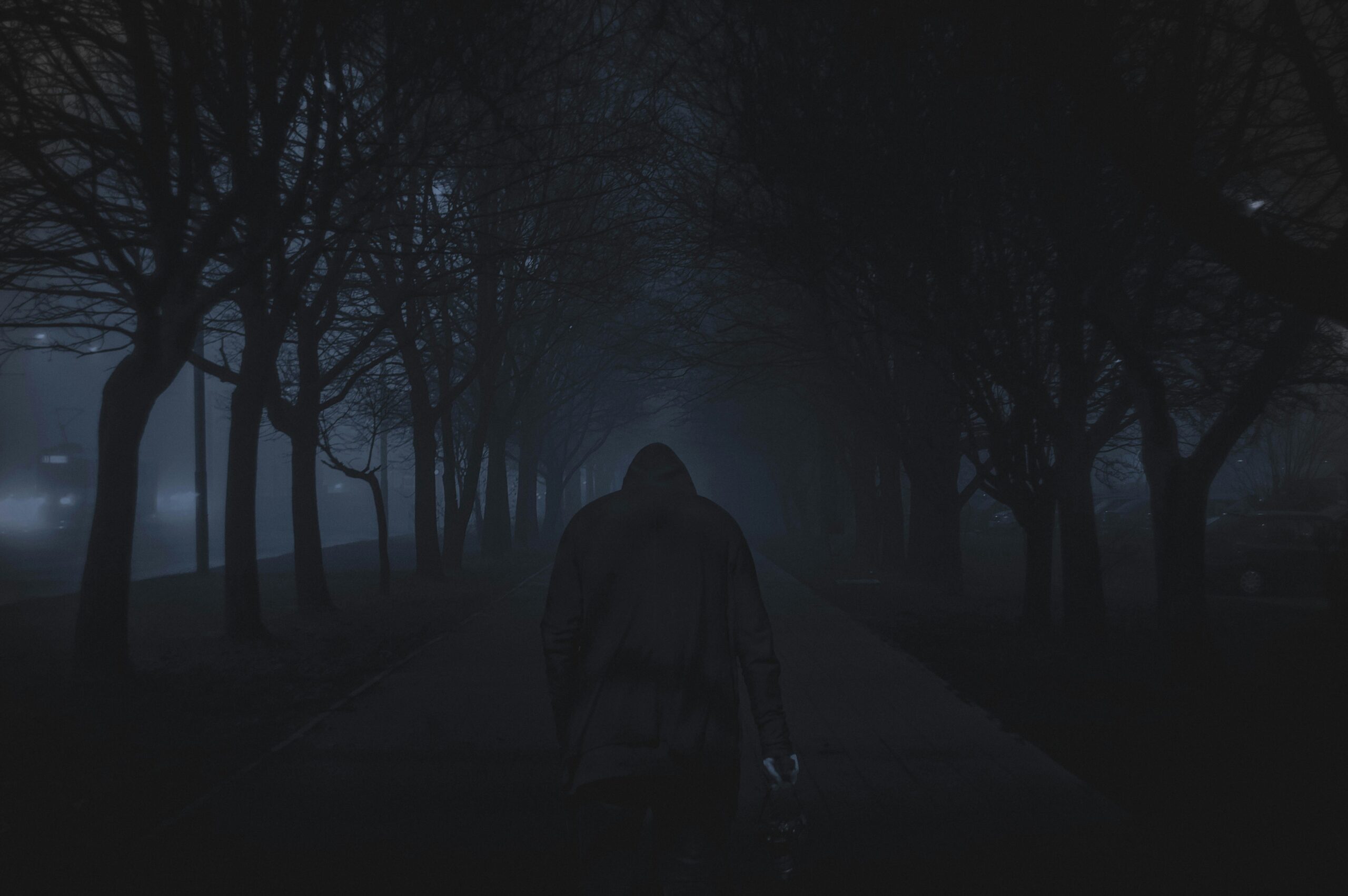 best psychological horror games showing dark atmospheric game scene with foggy corridor and unsettling character silhouette representing psychological horror genre