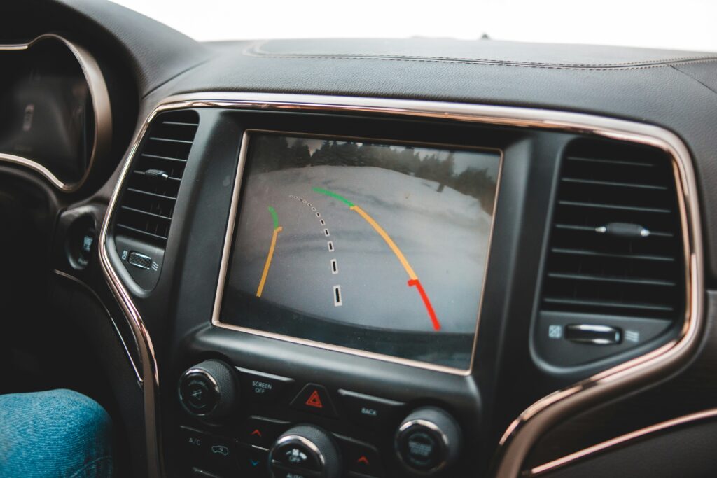 license plate backup camera showing a camera mounted on a vehicle license plate frame representing the best license plate backup cameras wired wireless and frame mount options for 2026