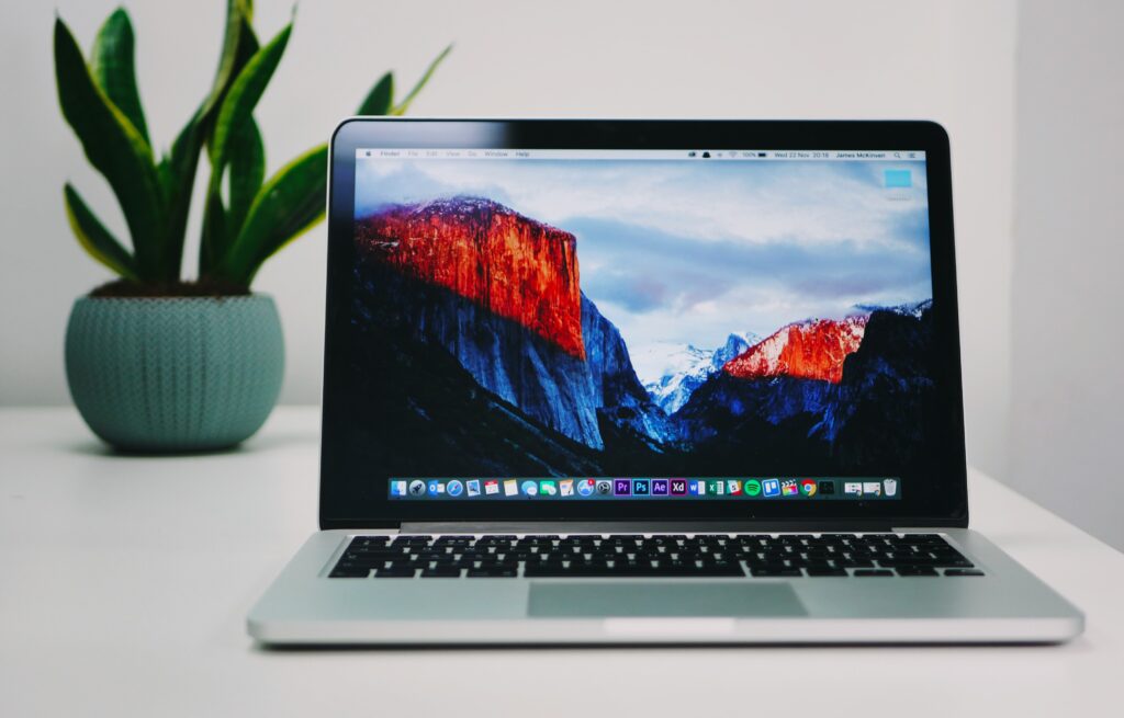 best laptops for writers showing Apple MacBook Air M4 open on a desk with a document on screen representing the top lightweight laptops with the best keyboards and battery life for writers in 2026