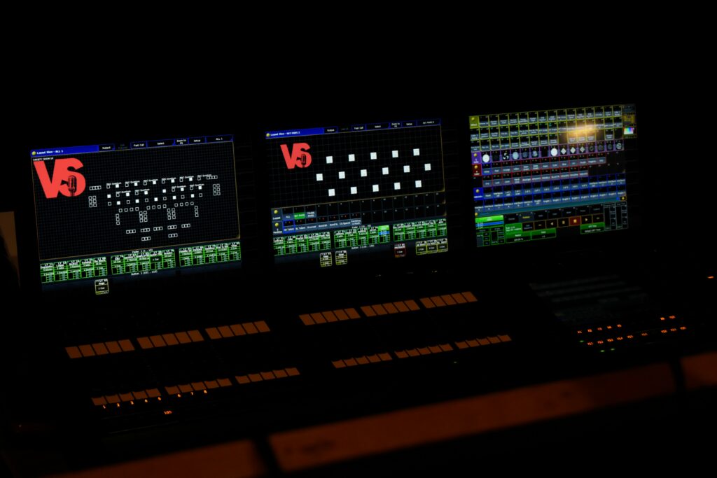 what is a kvm showing a KVM switch device connected to two computers and one monitor keyboard and mouse representing what a KVM switch is how it works types and multiple monitor setup for gamers and streamers