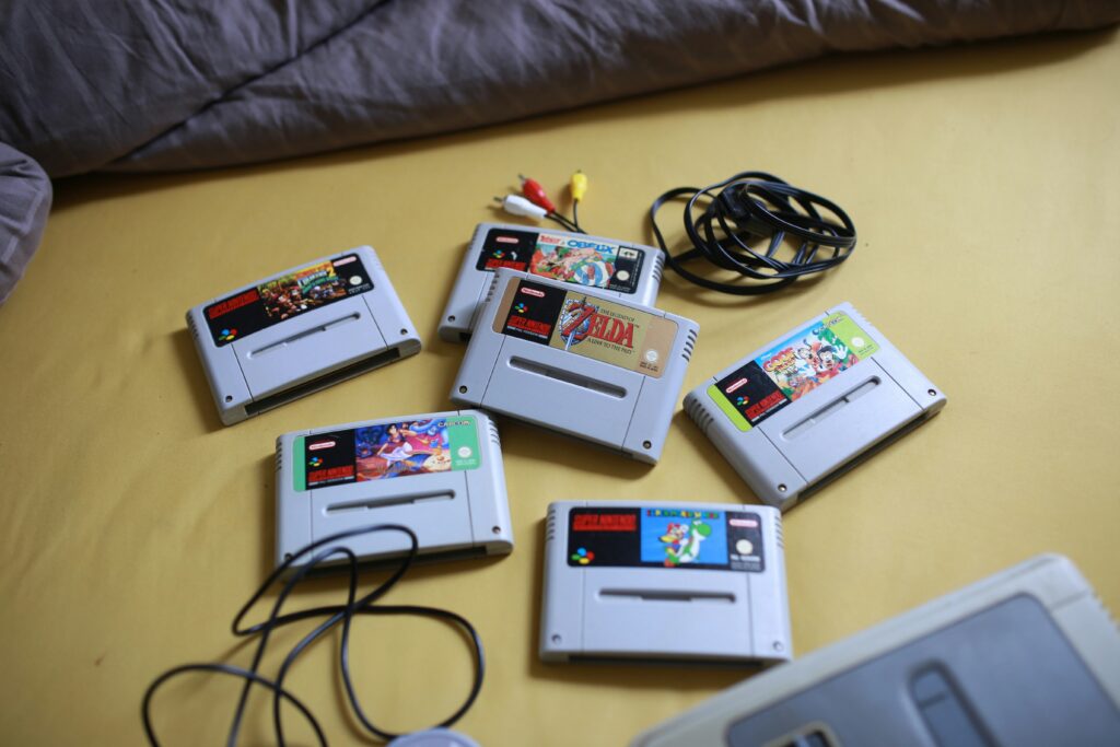 best snes games collection showing Super Nintendo cartridges and controller