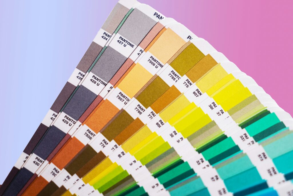 cmyk to pantone converter showing color swatches with CMYK percentage values and corresponding Pantone PMS color codes in a design software color panel