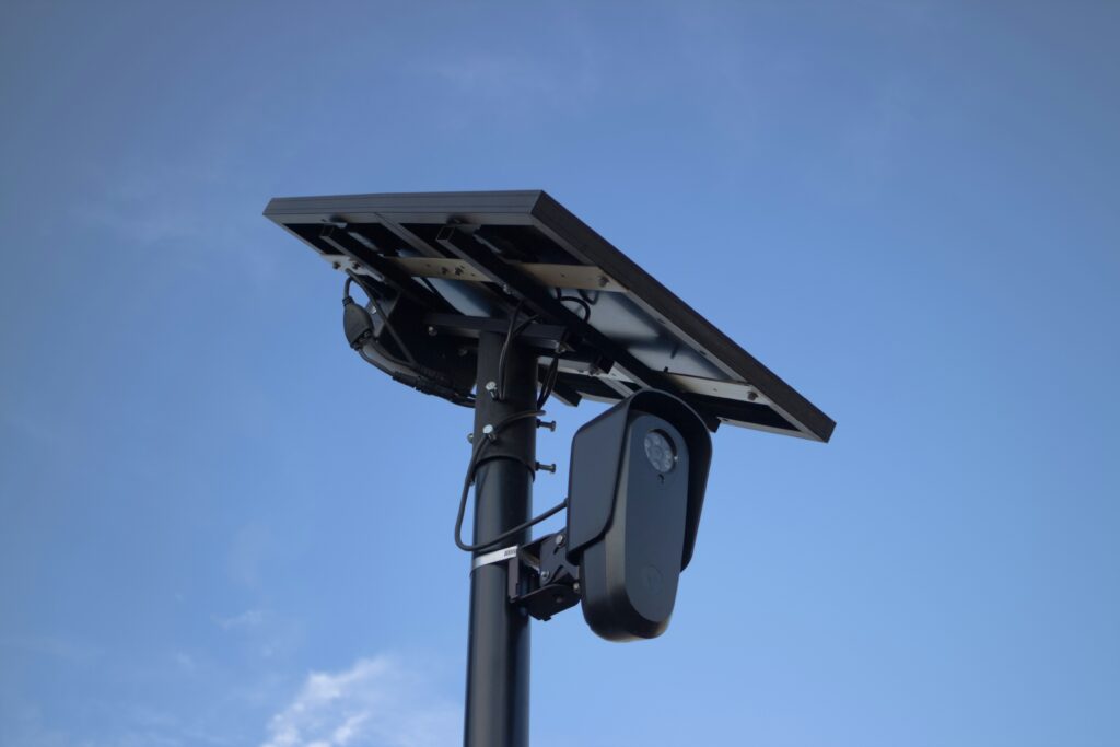 license plate camera showing an LPR camera mounted on a post reading a vehicle license plate representing what is an lpr camera how license plate recognition works and lpr camera systems explained