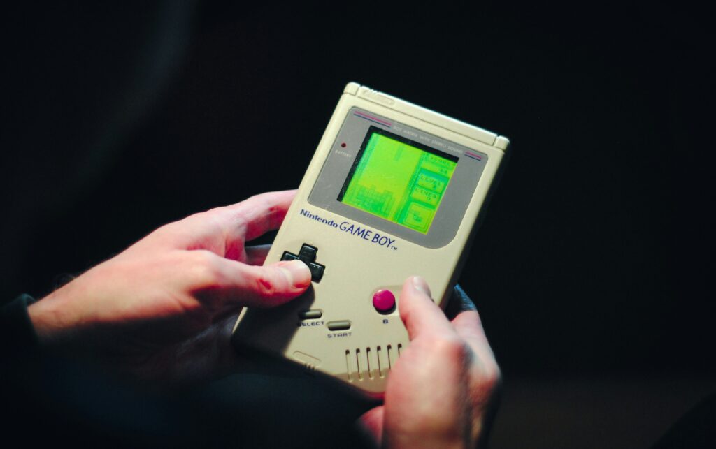 best retro gaming handheld showing an Anbernic RG35XX Pro portable retro console with colorful game screen representing the top handheld retro game consoles for playing classic games in 2026