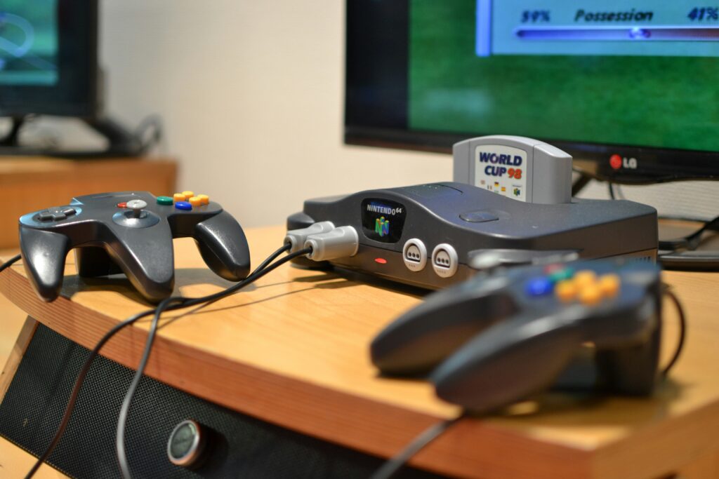 best retro gaming consoles 2025 showing Miyoo Mini Plus, Retroid Pocket 5, and Anbernic RG35XXSP handheld emulation devices side by side representing the top retro gaming hardware options