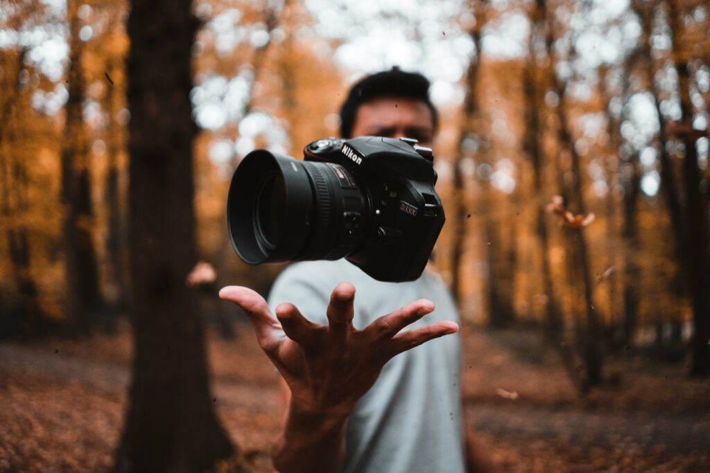 best starter camera for photography showing Canon EOS R100 and Sony ZV-E10 II mirrorless cameras for beginner photographers on white background