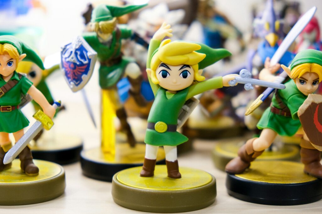 best Zelda games ranked showing a lineup of Legend of Zelda game covers from across the series representing a ranked list of every mainline entry from worst to best