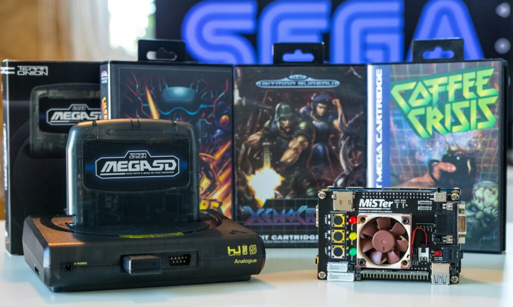 best sega master system games showing Sega Master System console with controller and game cartridges including Alex Kidd and Phantasy Star