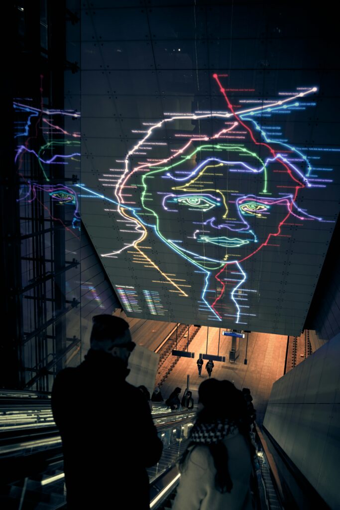 free projection mapping software showing MapMap interface with mesh warping controls and 3D surface preview on left monitor with projected output on right