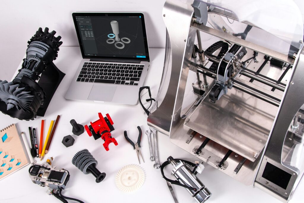 3d modeling and slicer software for 3d printing showing a computer screen with a 3d model and slicer interface representing the design and print preparation workflow