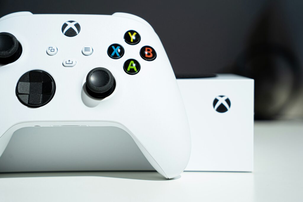 Xbox vs PlayStation which is better 2026 showing Xbox and PlayStation controllers representing is xbox or playstation better more popular xbox vs playstation exclusives which to buy guide 2026