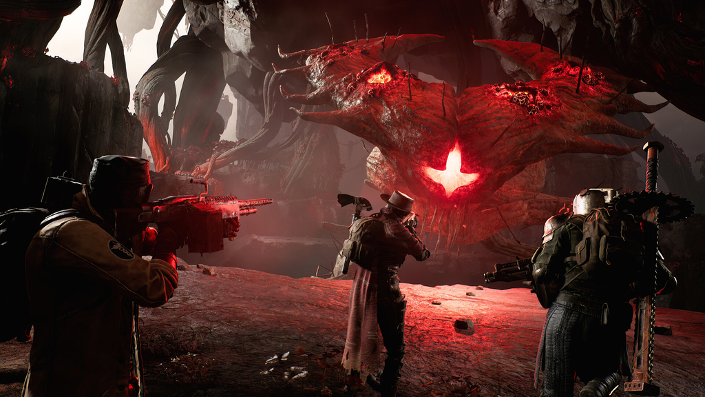 Remnant 2 three-player squad facing a massive boss creature in a dark alien environment